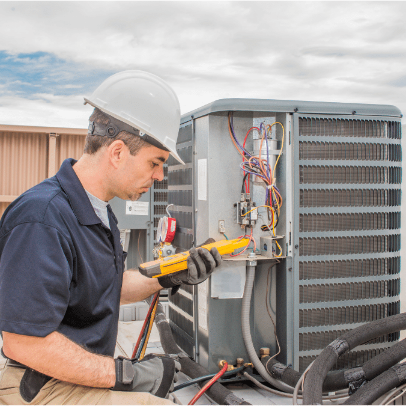 Cambridge HVAC Pro HVAC technician servicing a system