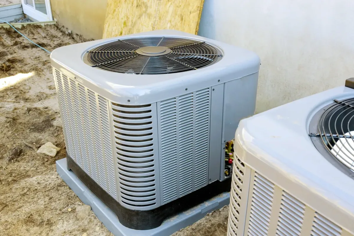 Two outdoor air conditioner condensers